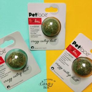 3 catnip balls arranged in a triangle shape on a green and yellow background with cativity box logo in the center