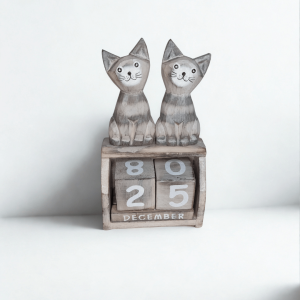 Hand-carved wooden cat perpetual calendar with two grey cats and wooden date blocks. A charming handmade home décor piece and perfect gift for cat lovers.