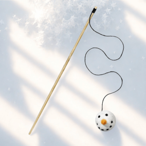 Snowman cat wand toy with felt snowman ball and long black string, displayed on a light star-patterned background.