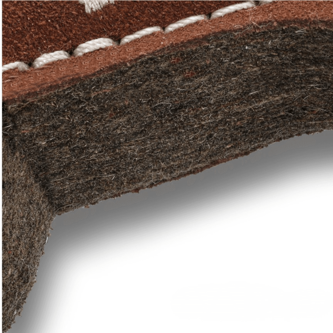 Close-up of the edge of the natural wool felt dog toy showing compressed felt texture and sturdy stitching for durability.