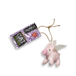 Eco-friendly felt flying pig cat toy with jute string attached to Green & Wild’s label, displayed on a white background.